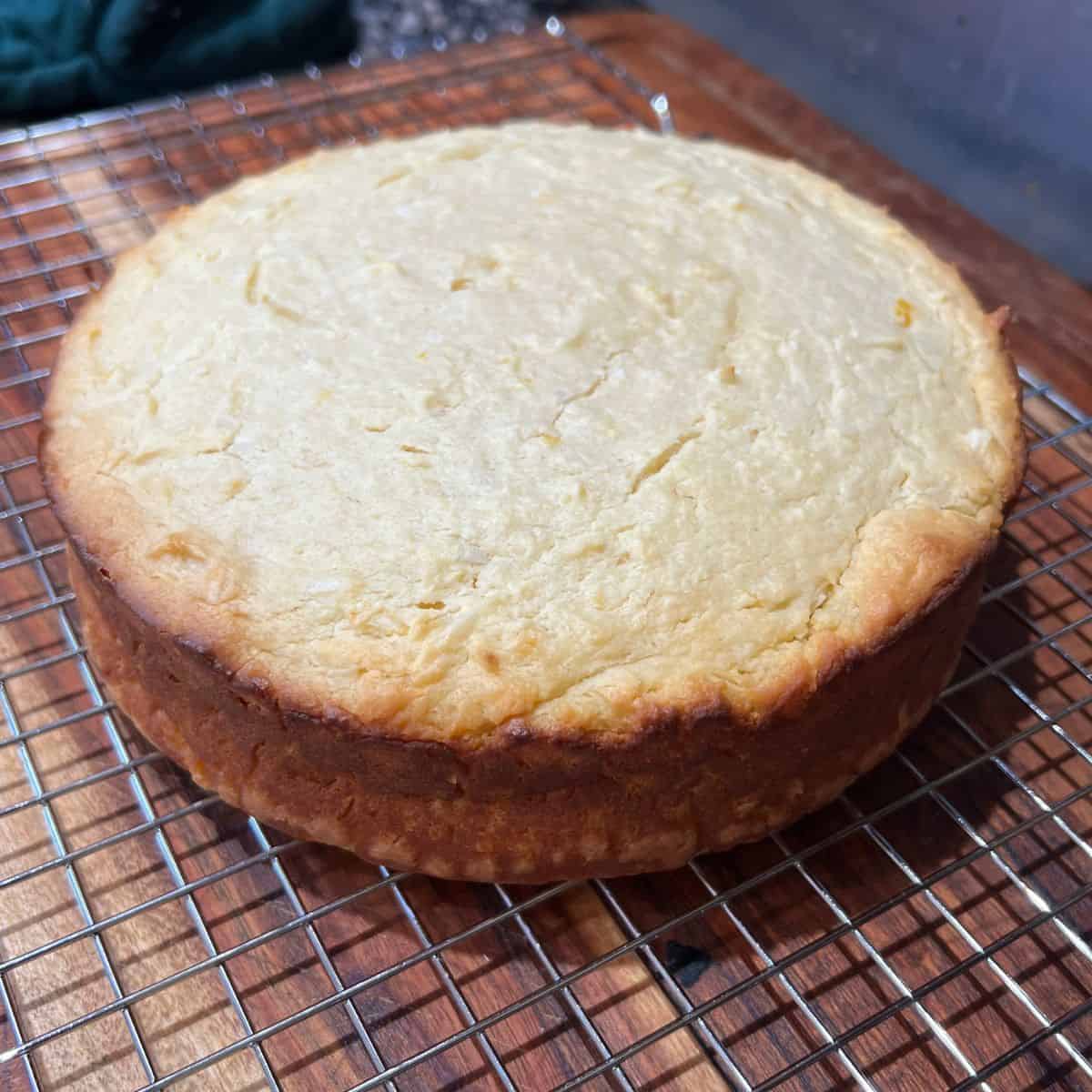 Moist lemon coconut cake cooling on a wire rack