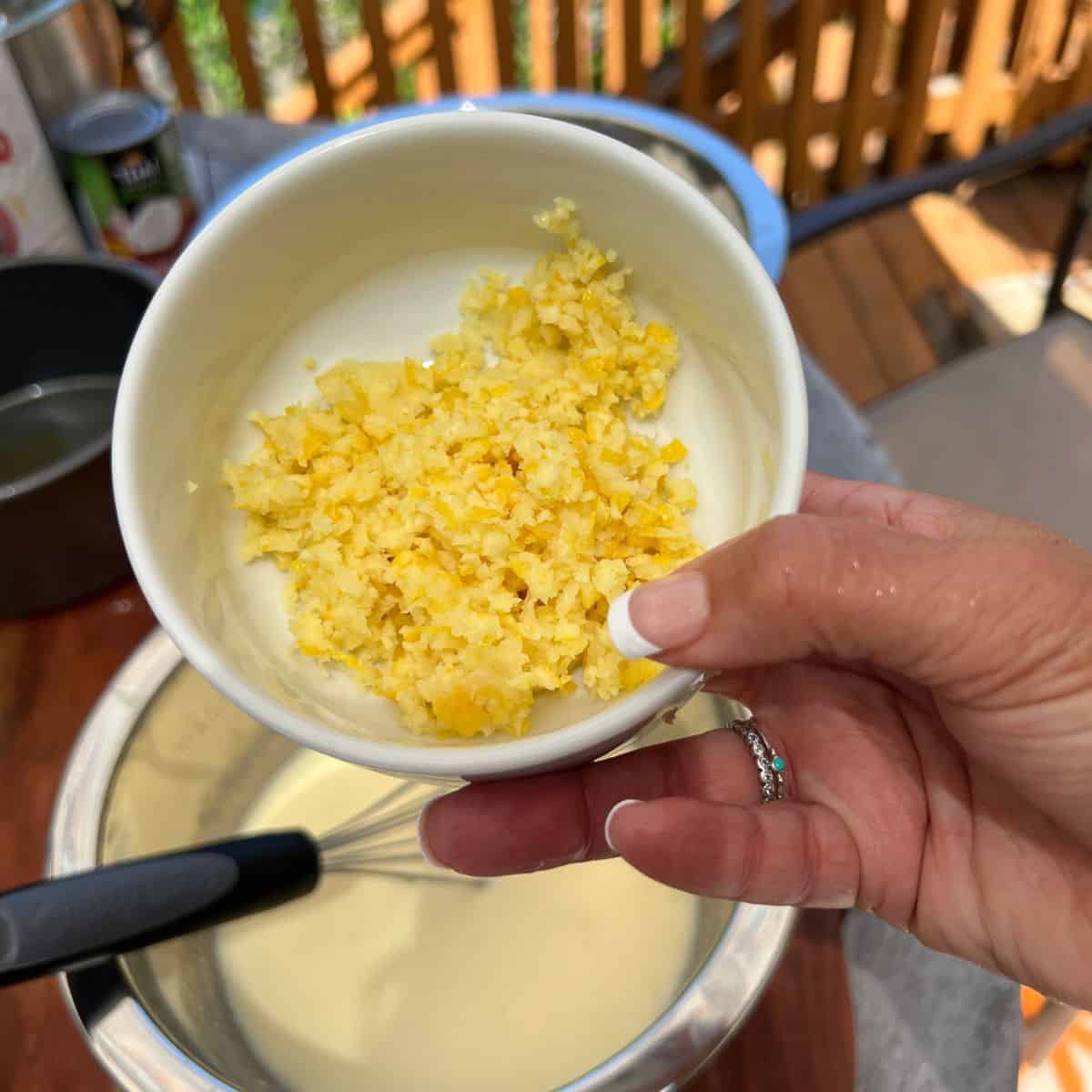 Lemon zest in a bowl for a coconut-lemon cake recipe