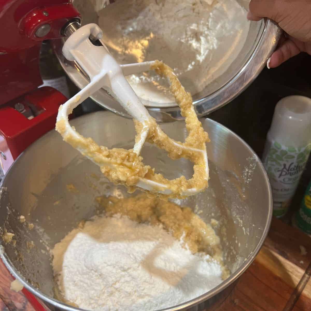 Dry ingredients being poured into Kitchenaid mixer for smores cooke recipe