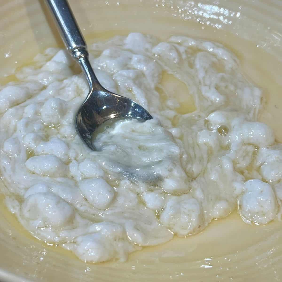 Stirring melted marshamallows for pbfit puffed rice balls