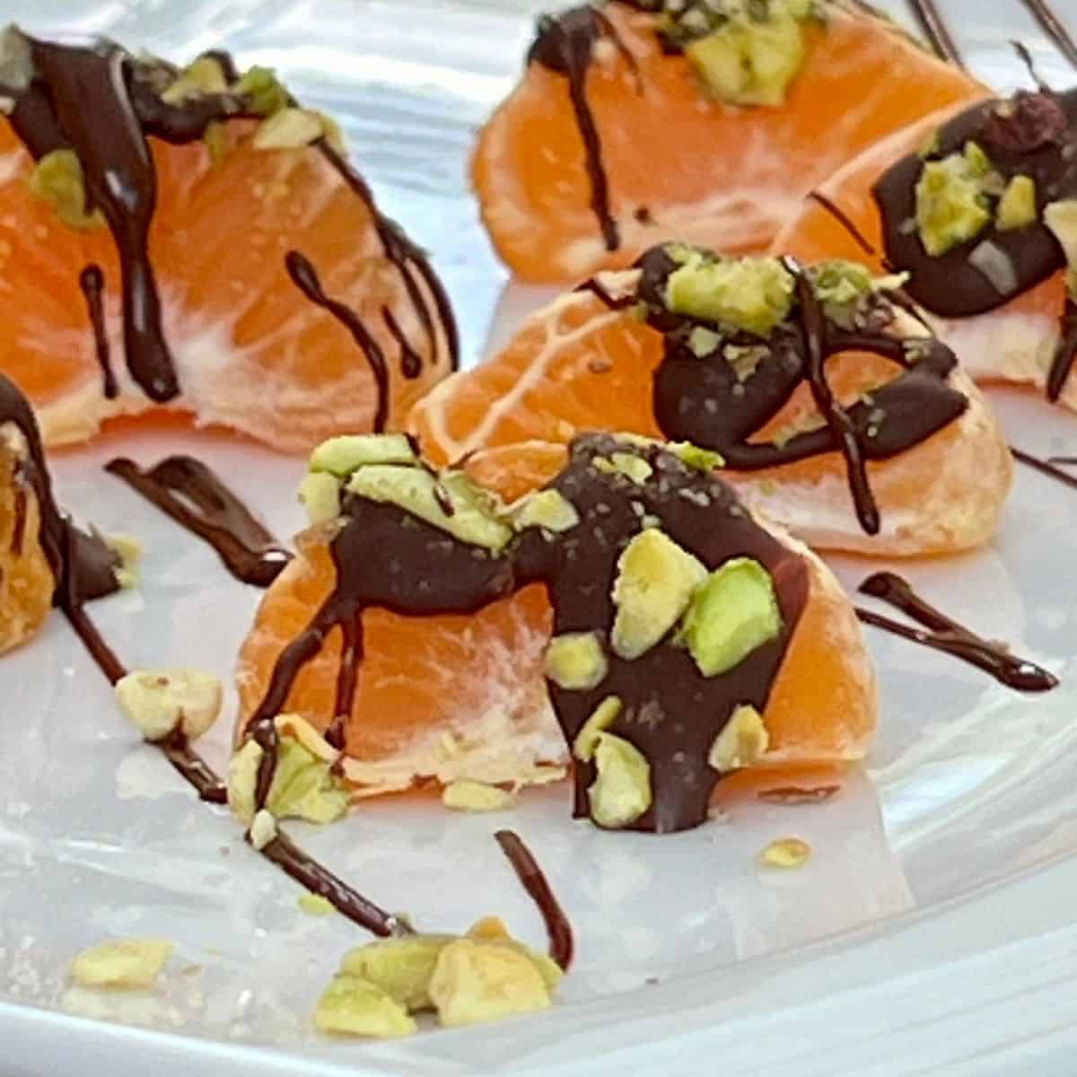 Chocolate covered clementines with pistachios
