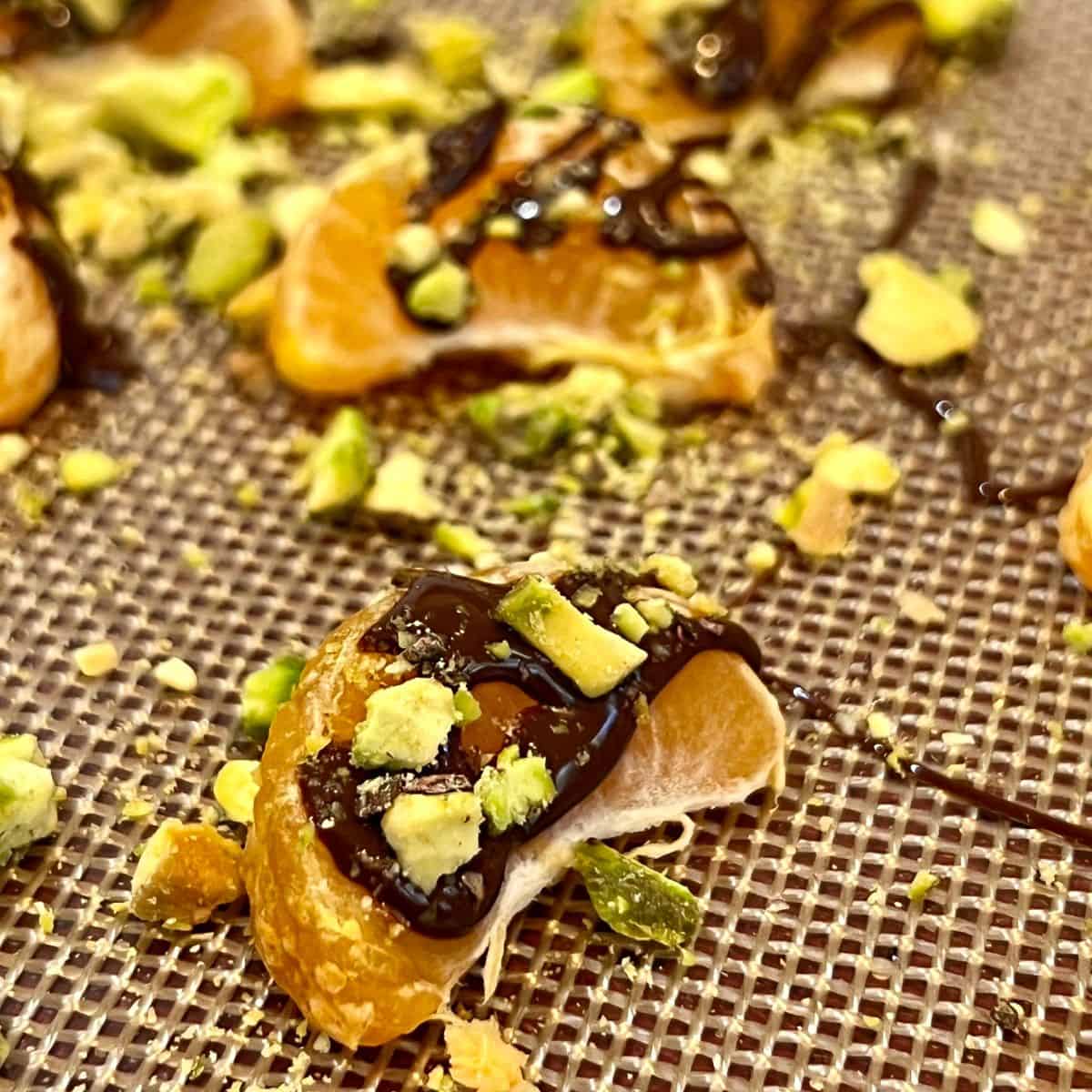 Chocolate pistachio clementines on a sheet-pan