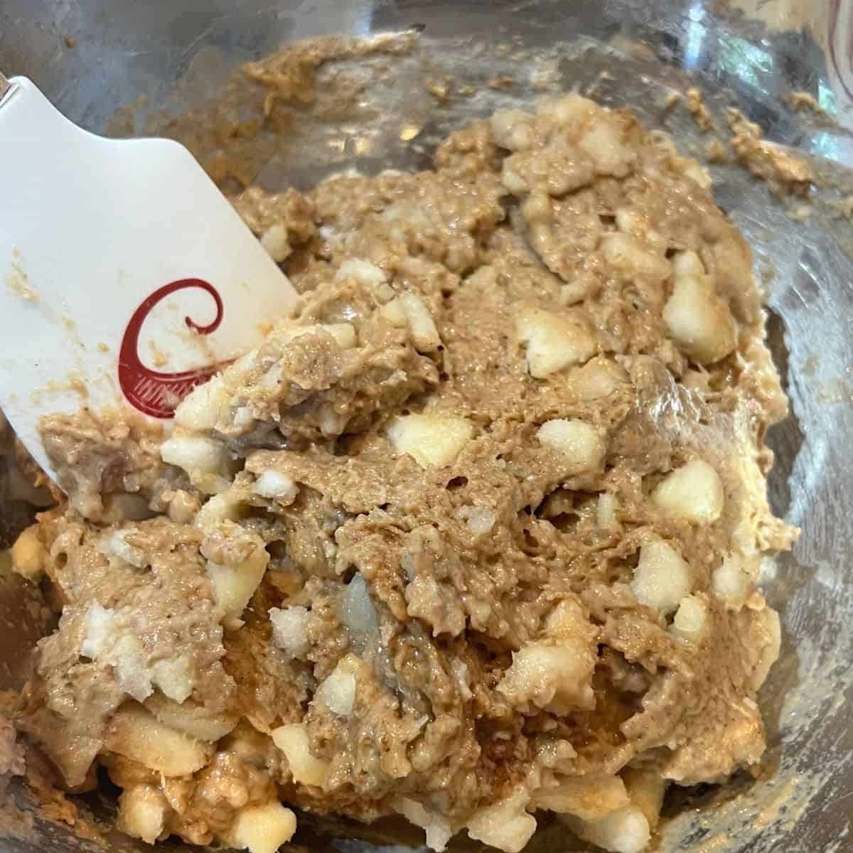 Cinnamon Pear Crumble muffin batter in a bowl
