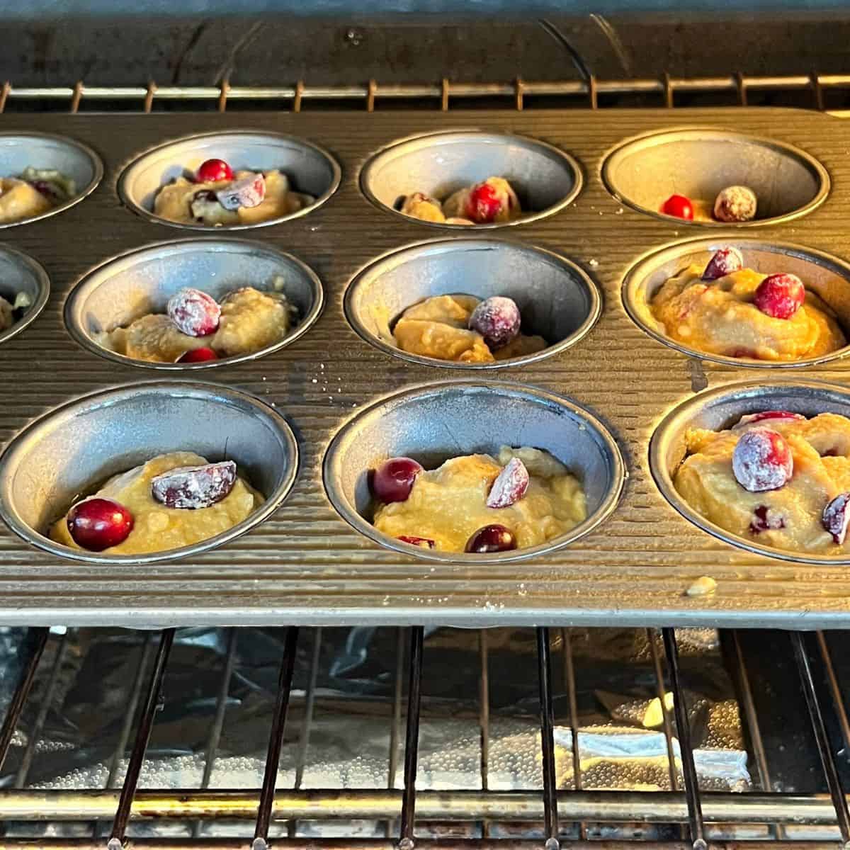 Orange cranberry muffins baking in the oven