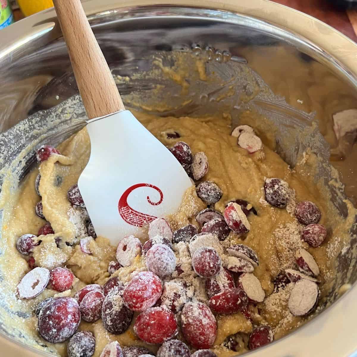 Cranberry muffin batter in a mixing bowl