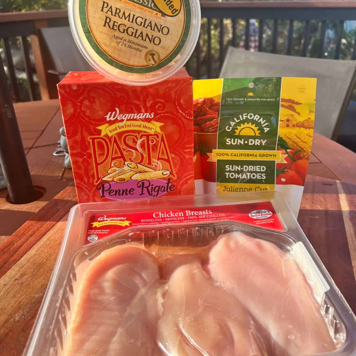 A box of Penne Rigate Pasta chicken cutlet sun dried tomatoes and parmesan cheese for the Marry Me Chicken Pasta Recipe