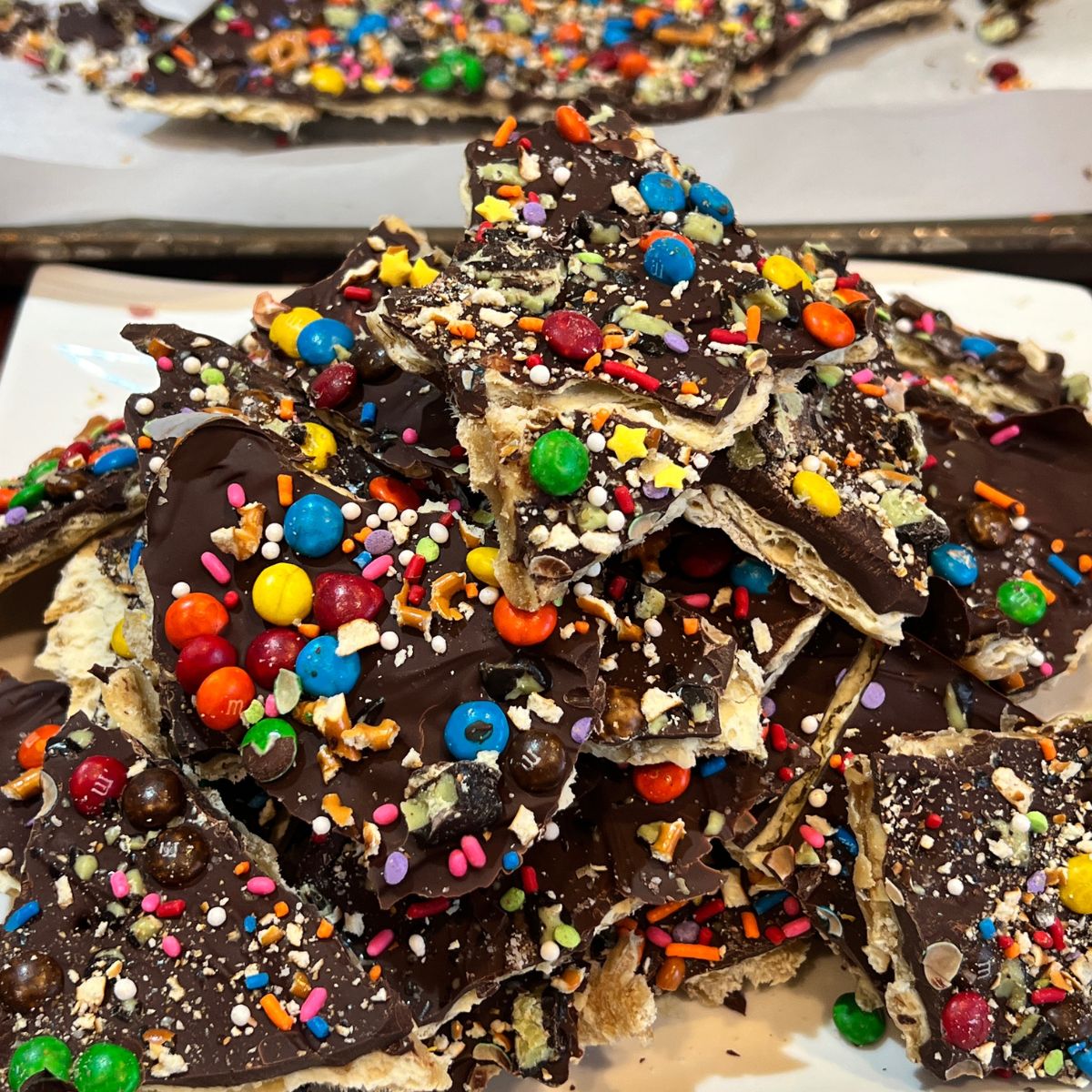 A stack of dark chocolate Christmas crack on a plate