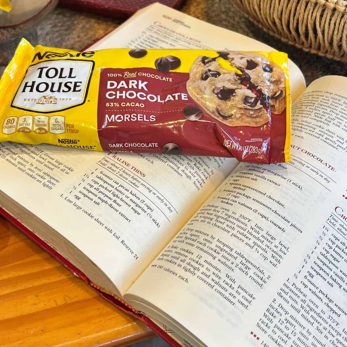 A bag of Toll House chocolate chips and a vintage good housekeeping cookbook