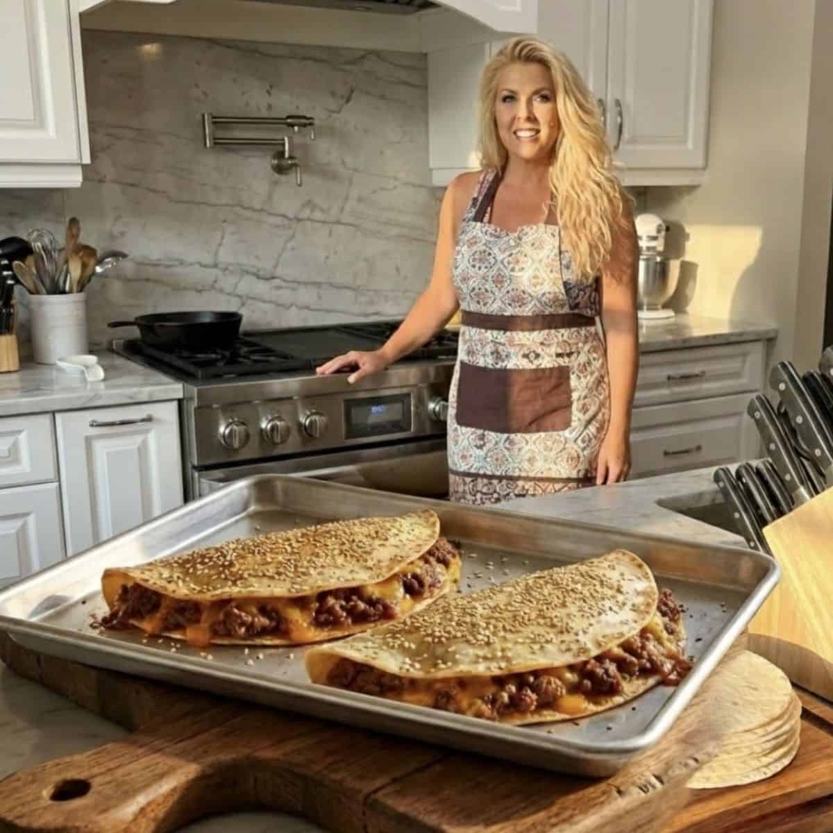 Sueseaqpi in the kitchen with oven baked sheet pan beef tacos on a tray