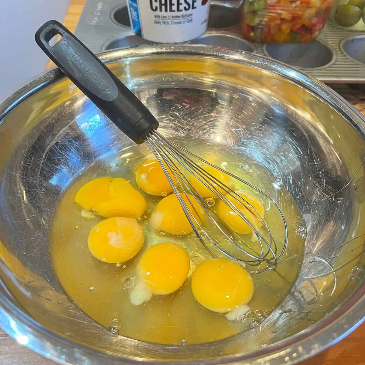Eight eggs in a stainless steel bowl