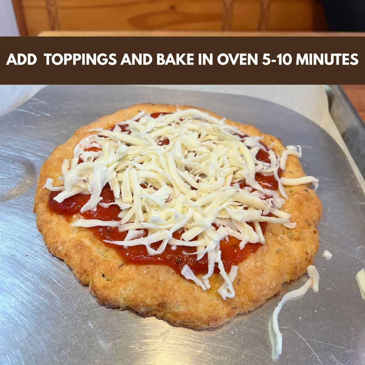 A cheese topped cottage cheese pizza crust on a pizza peel