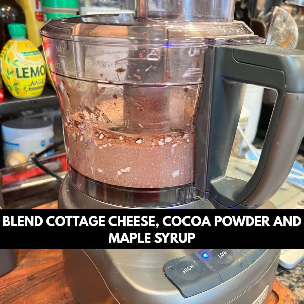 Cottage cheese unsweetened cocoa and maple syrup blending in a food processor