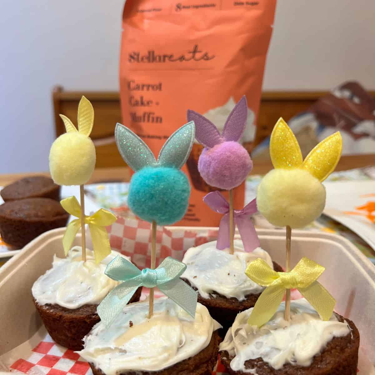 Healthy frosted carrot cake muffins with easter bunny picks