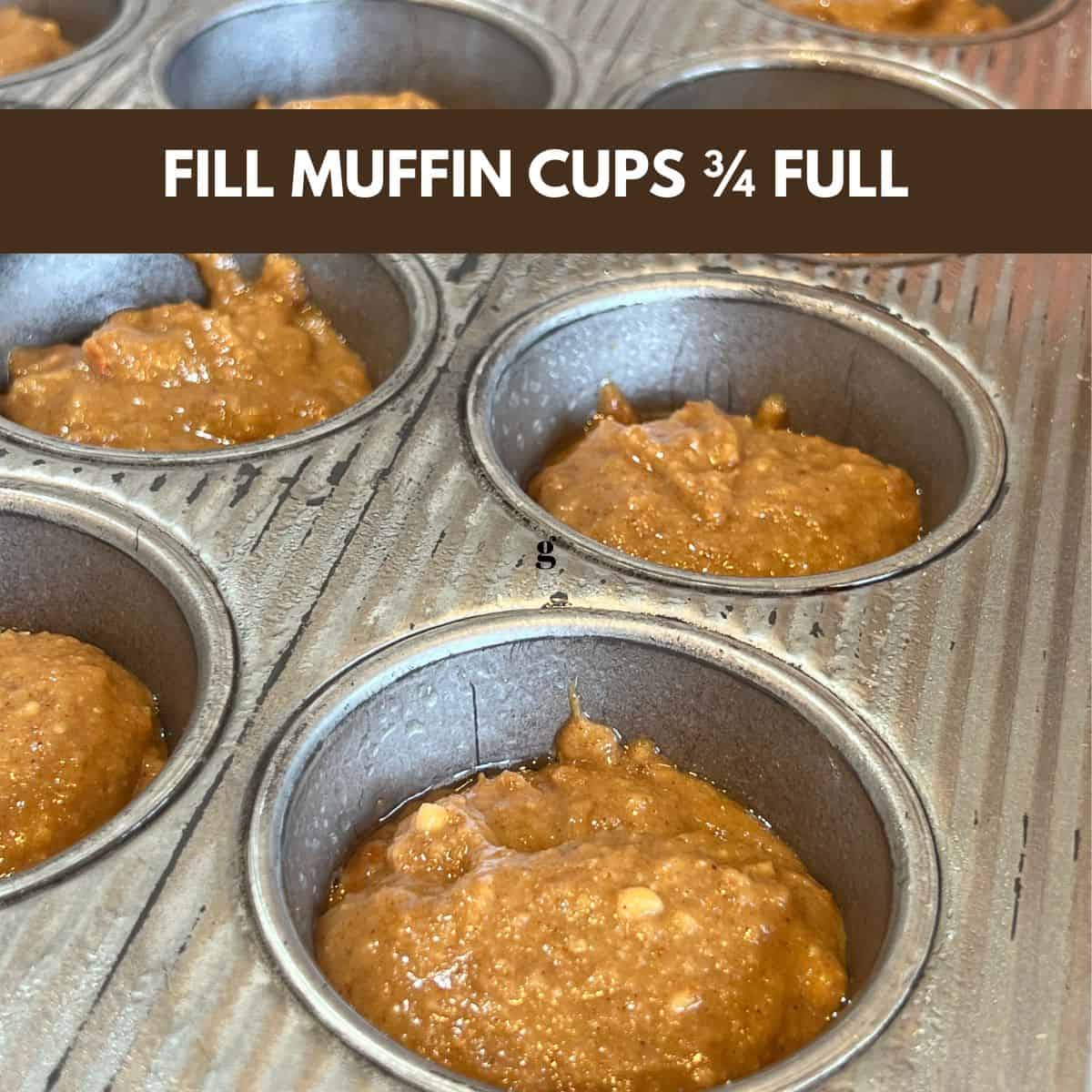 a muffin tin filled with carrot cake muffin mix