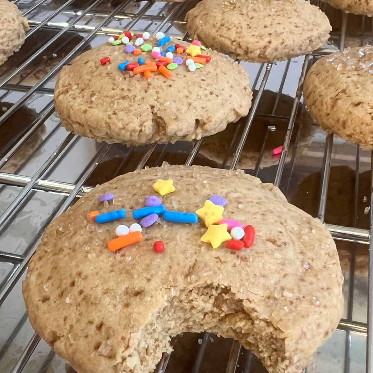 Healthier sugar cookies with sprinkles on a cooling rack