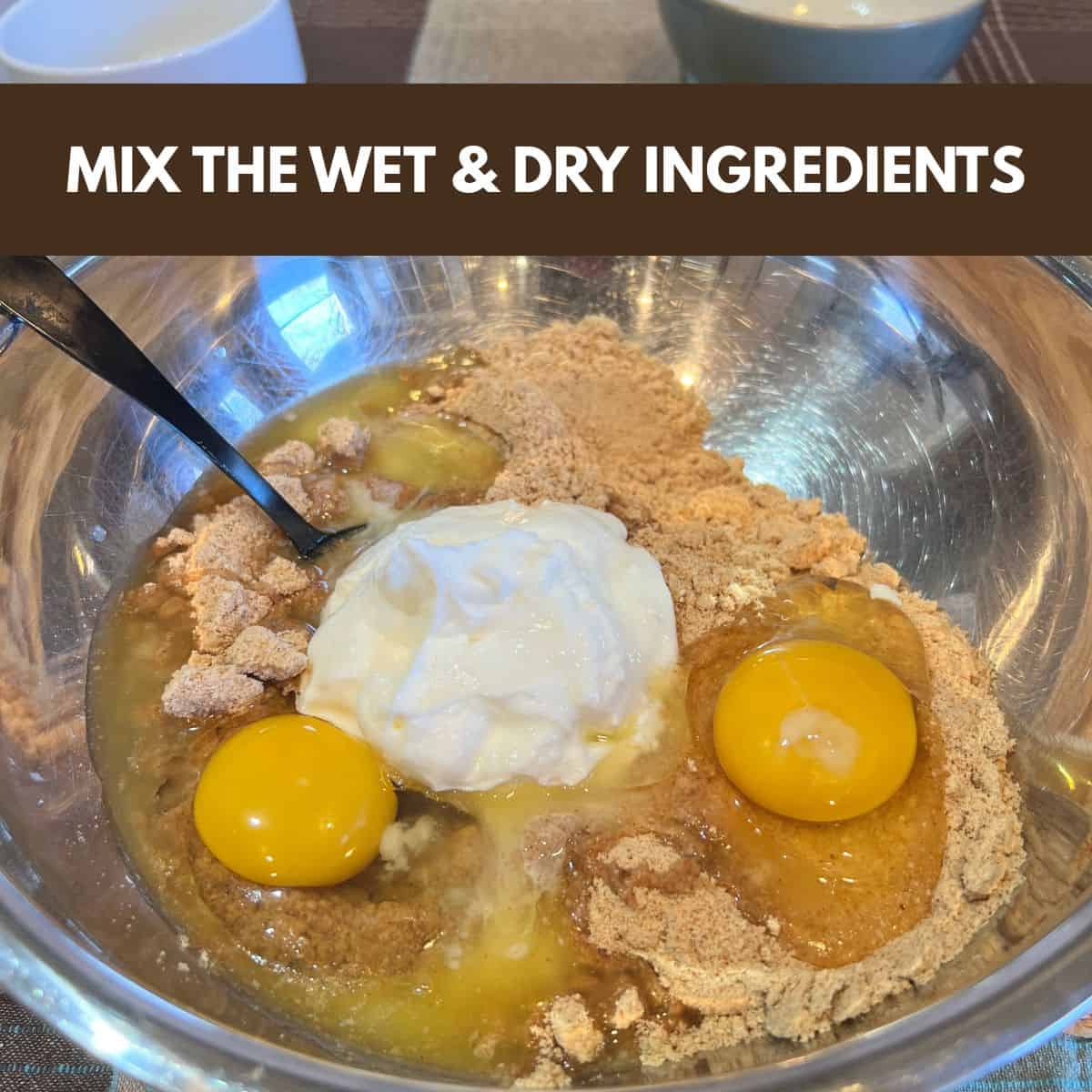 Eggs, Greek yogurt, almond milk, and coffee cake mix in a bowl being prepared to mix into muffin batter