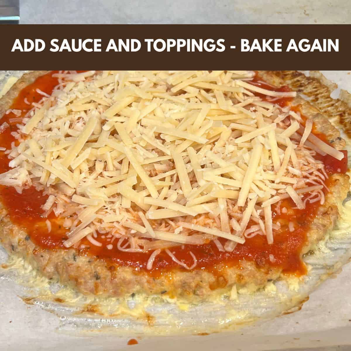 Adding pizza sauce and shredded cheese to baked keto chicken crust pizza before second bake