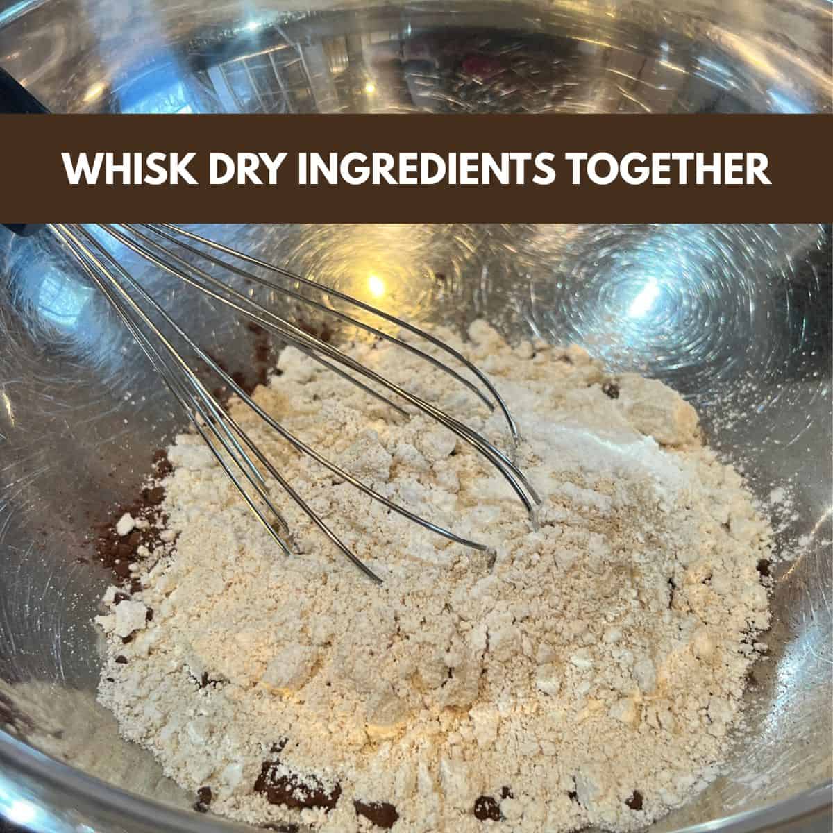 Bowl with cocoa powder, oat flour, and baking powder whisked together for chocolate peanut butter muffins