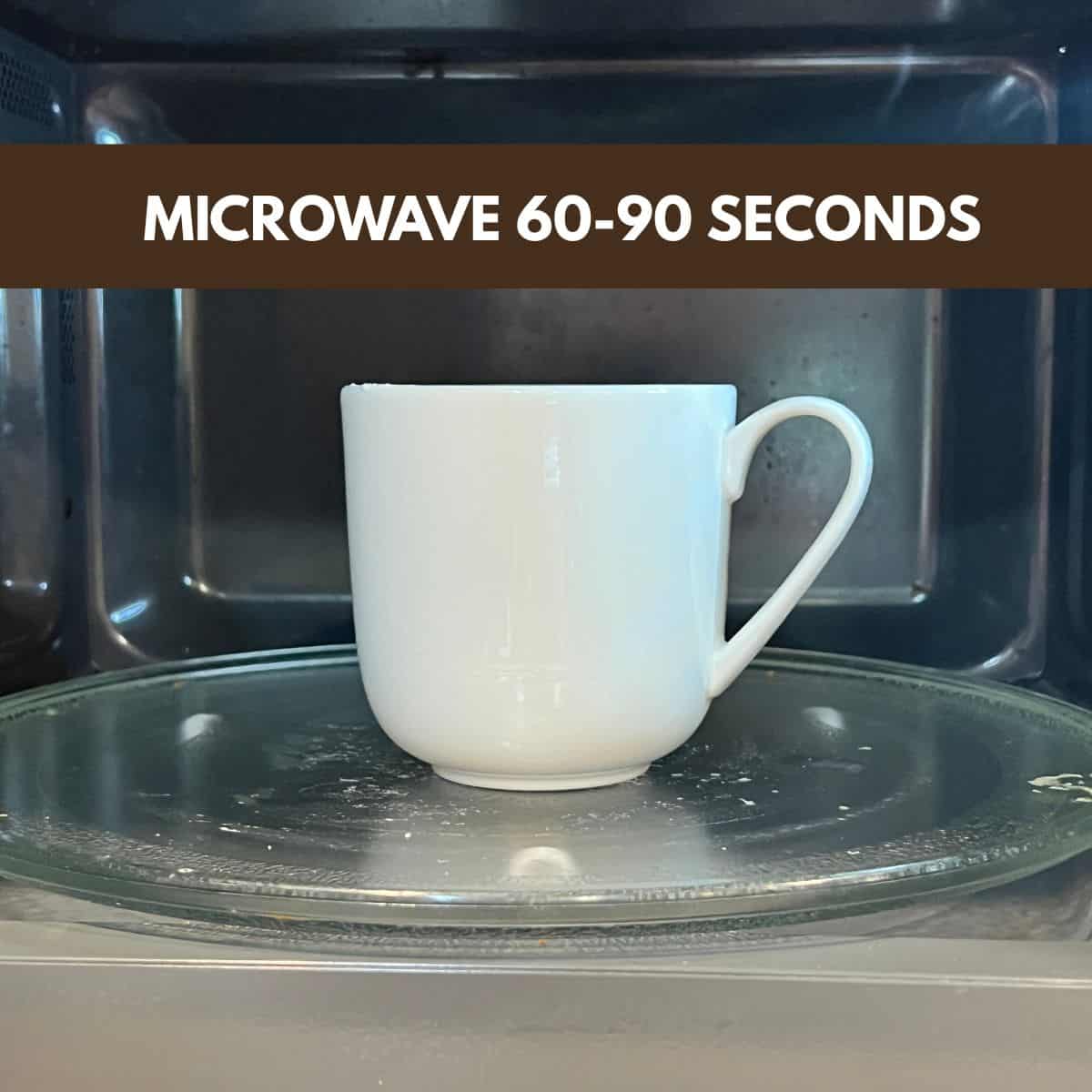 Strawberry mug cake in a mug after microwaving until set in the center