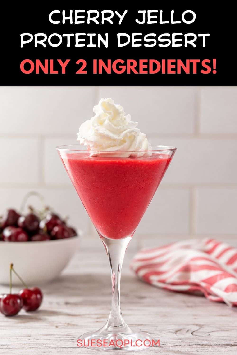 Pinterest pin featuring a high-protein cherry Jell-O fluff dessert made with Greek yogurt, served in a martini glass with whipped cream on top.
