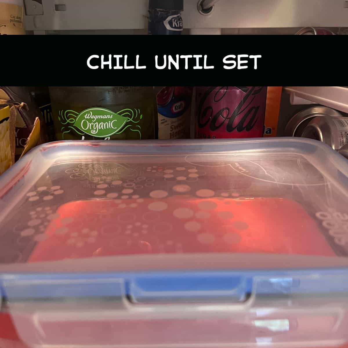 Cherry protein Jell-O dessert chilling in the refrigerator until set.