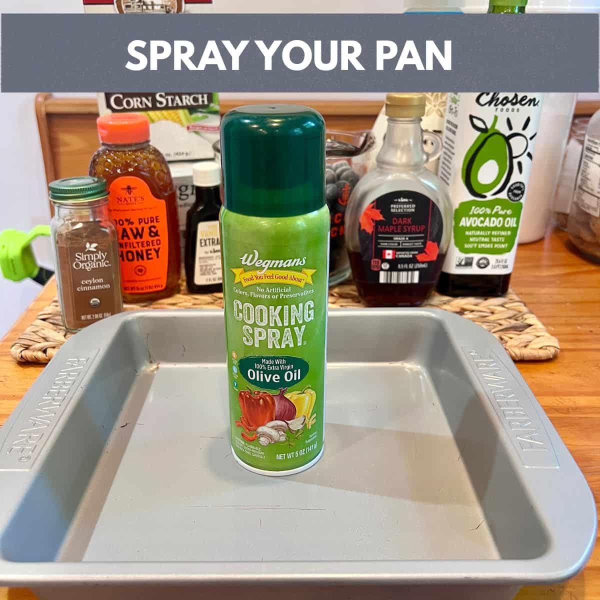 A can of spray olive oil in a n 8x8 baking pan