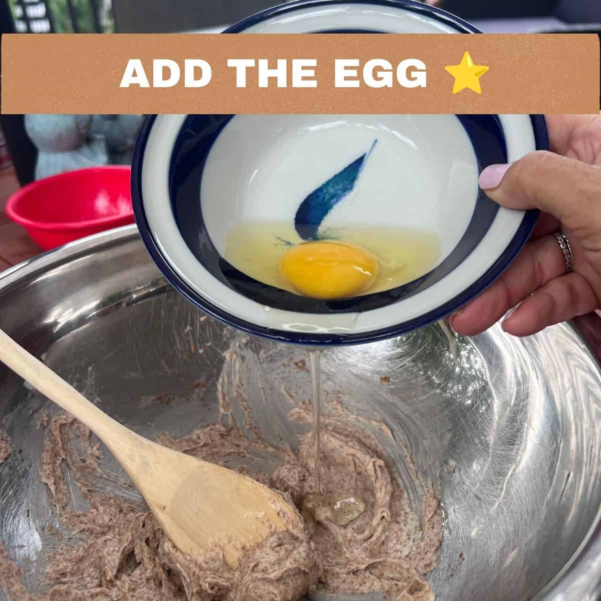 Adding an egg to the butter and coconut sugar mixture while making Almond Flour Butter Cookies.