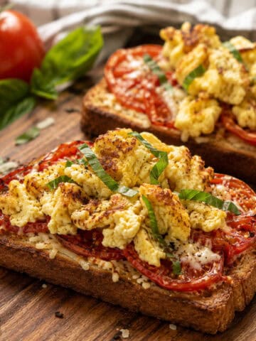 High protein tomato and egg breakfast pizza toast with cottage cheese scrambled eggs on sourdough