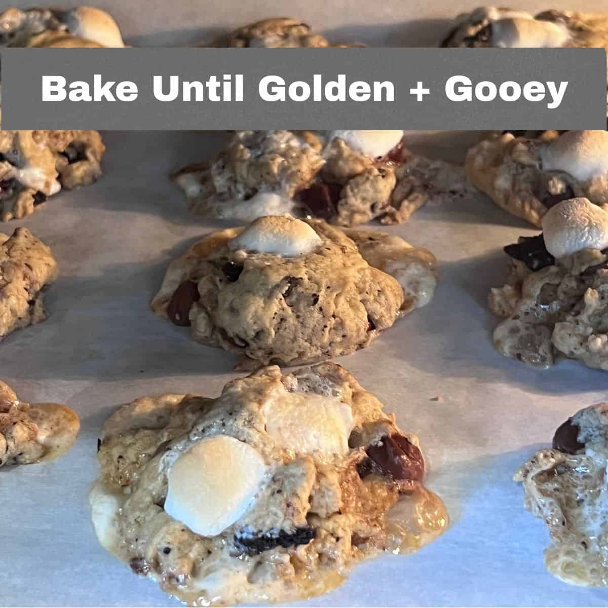 Oreo chocolate chip marshmallow cookies baking on a sheet pan until golden and gooey.