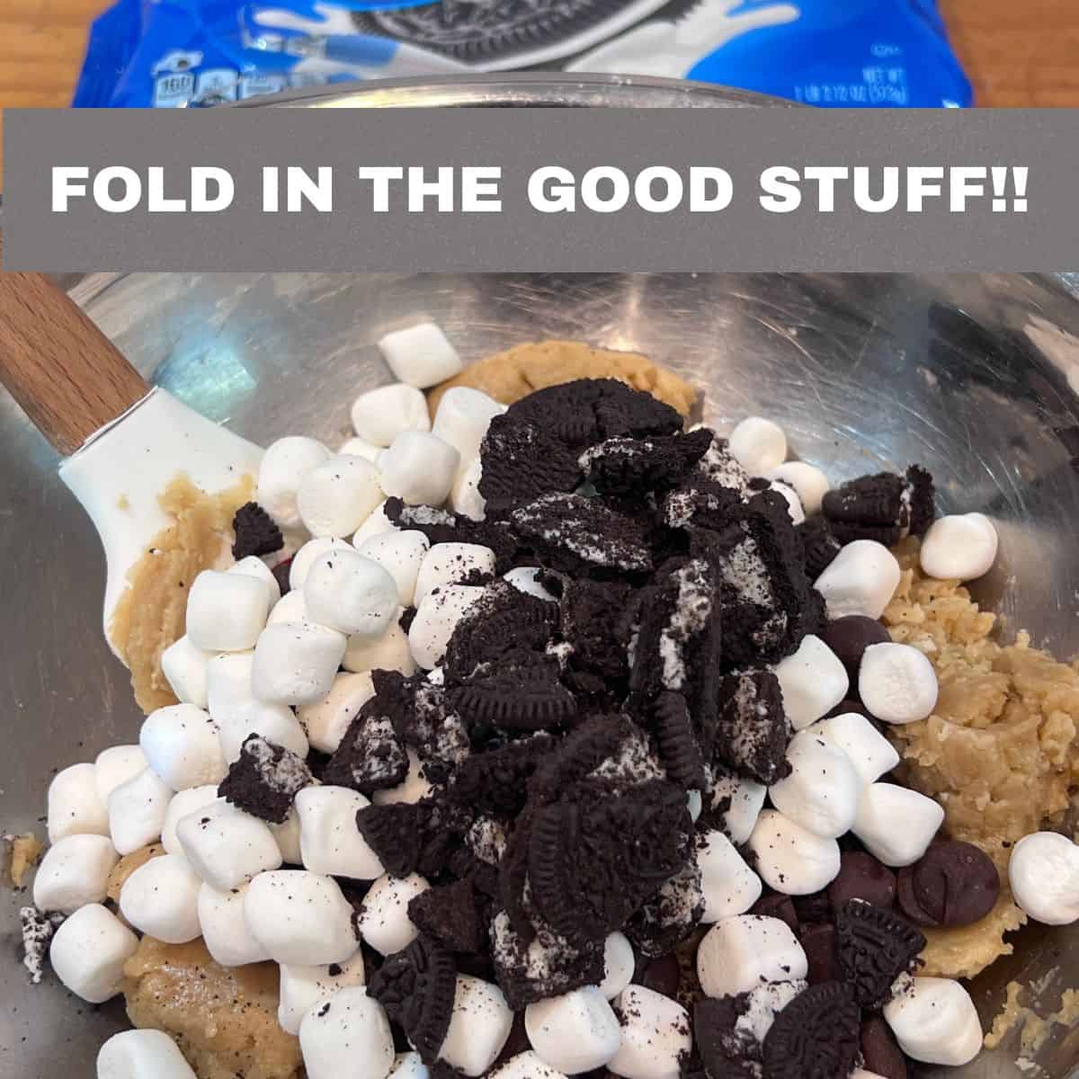 Oreo pieces, dark chocolate chips, and mini marshmallows folded into Oreo chocolate chip marshmallow cookie dough