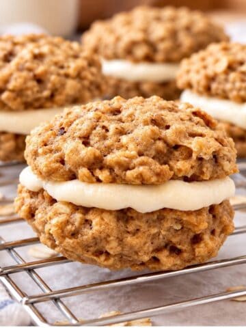 Healthy oatmeal cream pie cookies with creamy marshmallow filling on a cooling rack