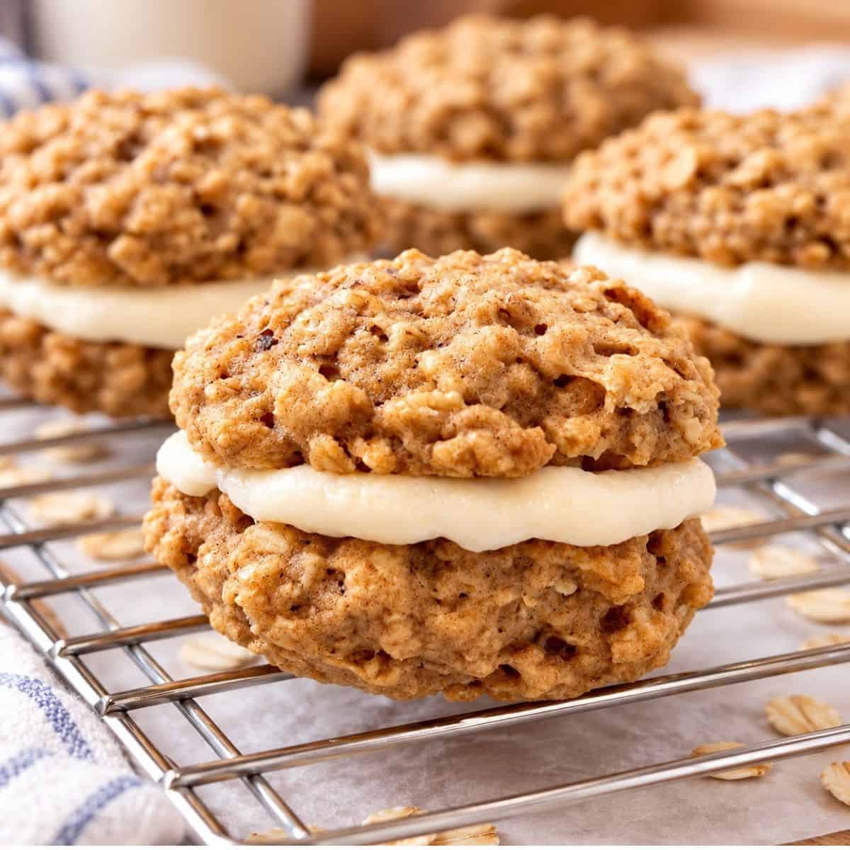 Healthy oatmeal cream pie cookies with creamy marshmallow filling on a cooling rack